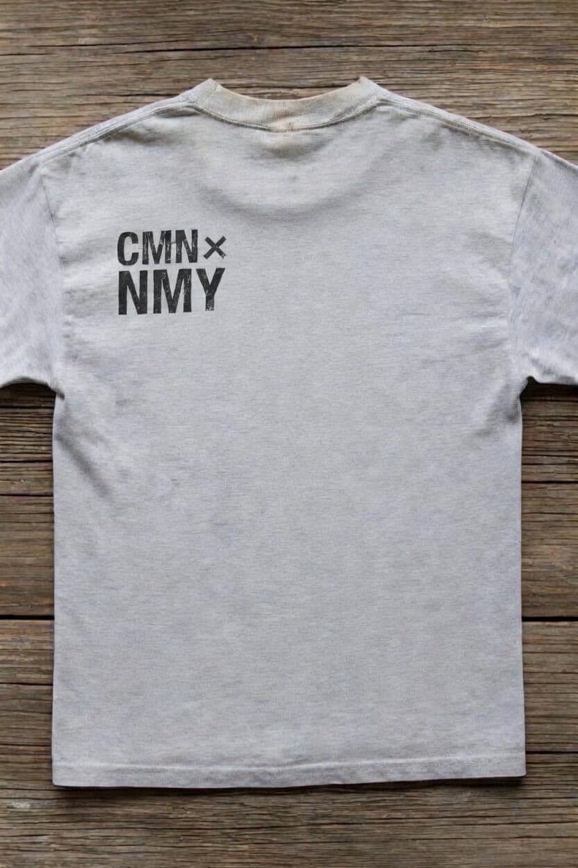 CMNNMY Unisex Tee — Front